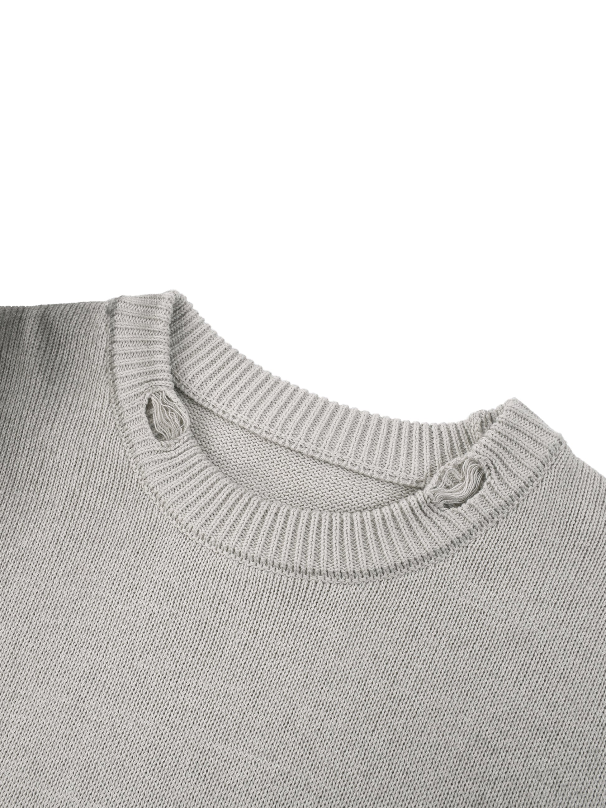 Ribbed knit crew neckline on light gray sweater with small distressed tie detail